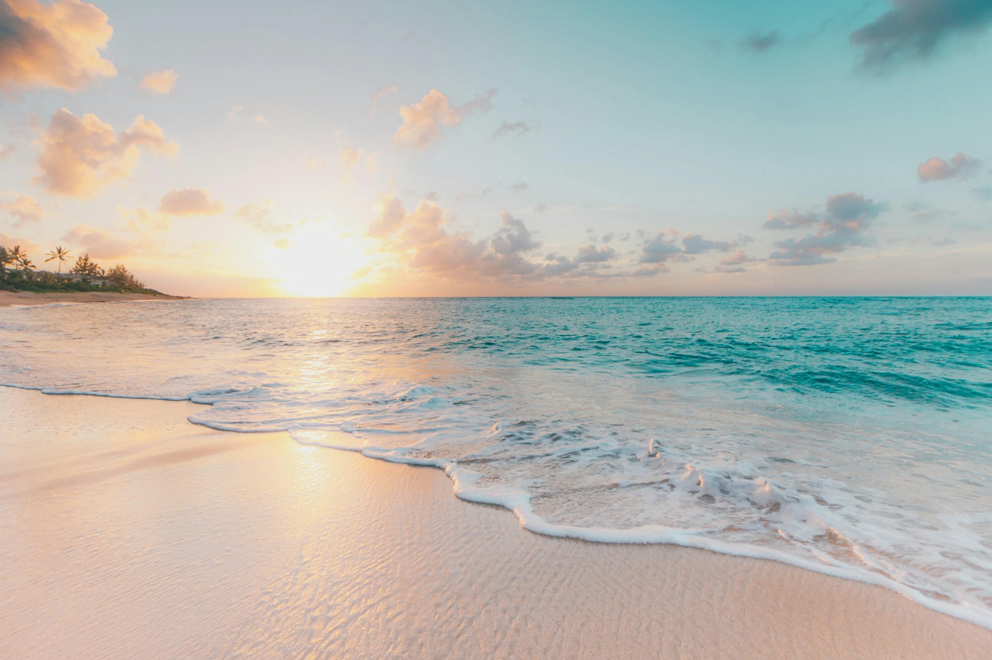 A wide beach at sunrise